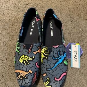 NWT Women’s size 8.5 TOMS Sneakers with Dinosaur Design - Black and Multi